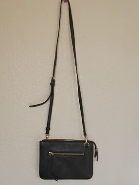 Black Crossbody Bag with Gold Zipper Accents and Adjustable Strap